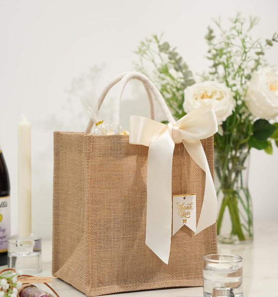JollyFayre Small Burlap Gift Bags 10 Pack for Wedding Welcome, Bachelorette, Beach, Bridesmaid - Reusable Bulk Jute Bags with Cream Ribbons - hover image